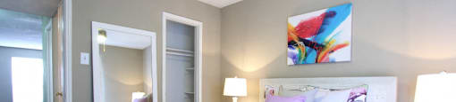 Spacious bedroom with ceiling fan and walk-in closet at Briarwood Apartments in Houston.
