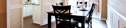 Spacious dining room with hardwood floors at Briarwood apartments in Houston.