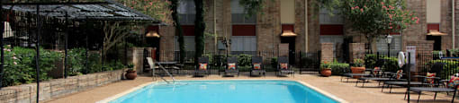 Townhome community with 4 swimming pools, beautiful landscaping, unique townhome community with a small community feel at Briarwood Apartments in Houston.