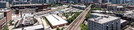 the city skyline with train tracks in the foreground