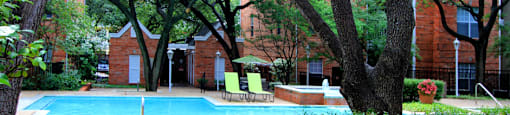 Luxury apartments with two resort-style swimming pools near the Mary Kay Museum with attached garages, golf course views, and beautiful landscaping in Dallas.