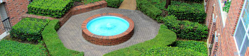 Gated apartment community near the Galleria with landscaped courtyards, beautiful landscaping, and beautiful courtyards with fountains.