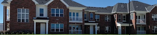 Luxury townhomes with attached garages, scenic views and red brick exteriors at Bellemeade Apartments in west Des Moines