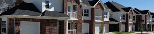 Luxury townhomes with attached garages, scenic views and red brick exteriors at Bellemeade Apartments in west Des Moines