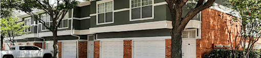 Luxury apartments in north Dallas near the Mary Kay Museum with beautiful landscaping, attached garages, and golf course views.