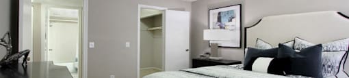 Spacious bedroom with walk-in closet and gray wall color at Inwood Apartments in La Vista, Nebraska