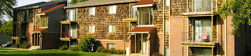 Apartments with scenic views, lush landscaping, park-like setting, and lots of trees at Inwood Apartments in La Vista, Nebraska