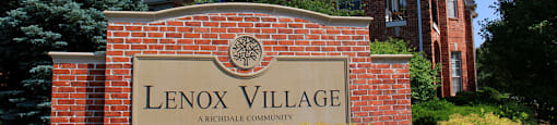 Luxury apartments located at 70th and Pioneers Blvd with red brick exterior and scenic views