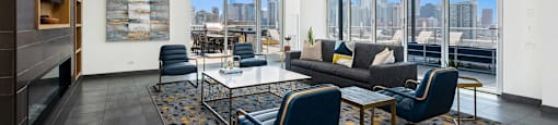 a lounge with a couch and chairs and a table