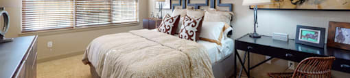 Luxury apartments with master bedroom to fit a king size bed, attached master bathroom and walk-in closet at Luxembourg Apartments in Bloomington Minnesota