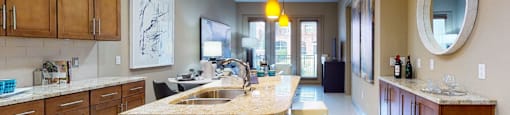 Luxury apartments in Bloomington Minnesota with spacious kitchen, granite countertops, stainless steel appliances, built-in wine rack, kitchen island, and porcelain tile floor at Luxembourg Apartments