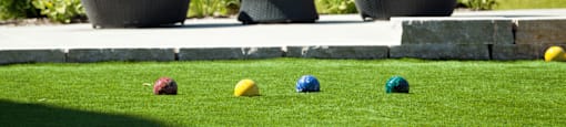 Luxury apartments with bocce ball court, brick exteriors and manicured gardens at Luxembourg Apartments in Bloomington Minnesota