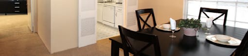 Spacious dining room and bright white kitchens at Plantation apartments in Houston.