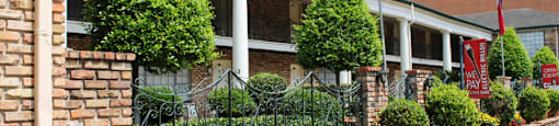 Apartments near the Galleria with brick exteriors, covered parking and courtyard setting at Plantation apartments in Houston.