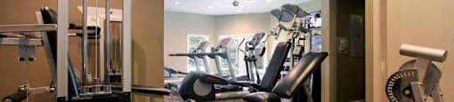 Luxury apartments with a fitness center in a gated community at Preston Village Apartments in North Dallas