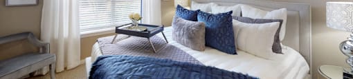 Luxury apartments with spacious bedrooms, walk-in closets, and ceiling fans at Tuscany Gate Apartments in Houston.