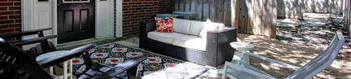 Private backyard patios and red brick exteriors at Tuscany Villas in Houston.