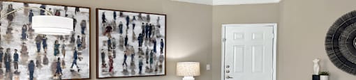 Spacious living room with crown molding and oversized windows at Village on the Parkway Apartments in Houston, Texas