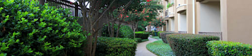 Luxury apartments next to the Galleria in Dallas with beautiful landscaping and spacious balconies at Villa Piana Apartments in Dallas