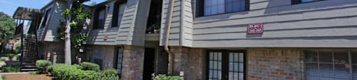 Gated apartment community close to the Galleria with pool, spa, poolside lounge chairs, lush landscaping, beautiful landscaping, and neighborhood setting.
