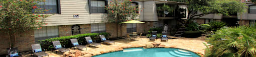 Gated apartment community close to the Galleria with pool, spa, poolside lounge chairs, lush landscaping, beautiful landscaping, and neighborhood setting.