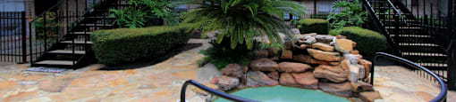 Gated apartment community close to the Galleria with pool, spa, poolside lounge chairs, lush landscaping, beautiful landscaping, and neighborhood setting.