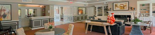 Huge clubhouse with spacious resident lounge, free wi-fi, and fitness center at Woodlake Oaks Apartments in Houston.