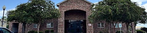 A building with a brick facade and a large entrance.