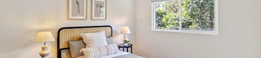 a bedroom with a bed and a ceiling fan