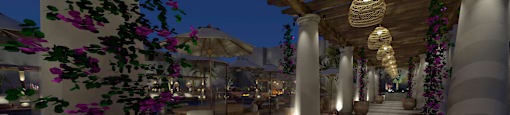 a corridor with potted plants and a restaurant at night