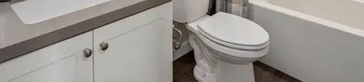 a bathroom with a toilet and a sink and a shower