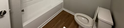 Park at Kirkstall 1-bed bathroom with a toilet and a bathtub.