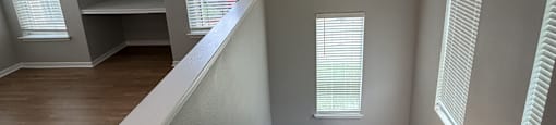Park at Kirkstall 2-bed staircase leads up to a landing with a window and a shelf.