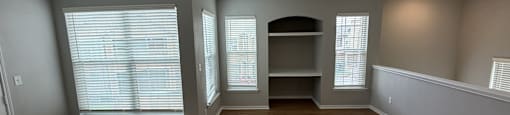 Park at Kirkstall 2-bed living room with wooden floors and a ceiling fan.