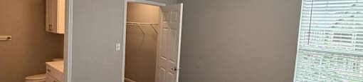 Park at Kirkstall 2-bed bedroom with a ceiling fan and carpeted floor.