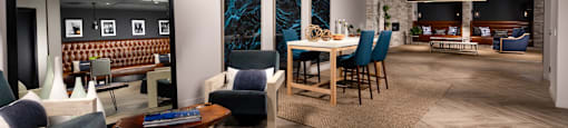 A modern living room with a wooden floor and furniture.