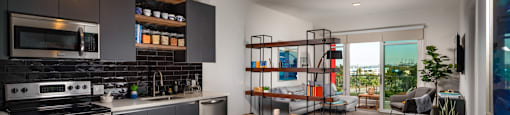 A modern kitchen with a glass table and chairs.