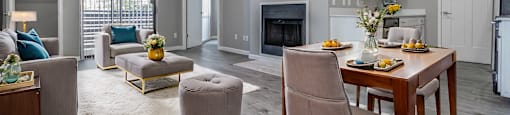 an open living room and dining room with a table and chairs
