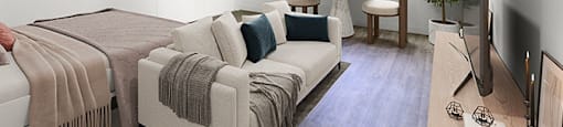 A living room with a couch, a chair, a television, and a window. at Bonnie Brae Apartments, Los Angeles