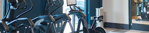 a fitness room with exercise bikes and a ceiling light at The Yards at Malvern, Malvern, PA