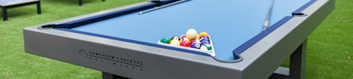 a pool table with balls on top of it in the backyard of a house at The Yards at Malvern, Malvern, PA