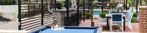 a pool table with an apartment building in the background at The Yards at Malvern, Malvern, PA