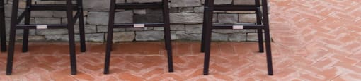 a bar with three stools in front of a house at The Yards at Malvern, Malvern, PA