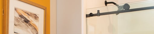 a bathroom with a toilet and a glass shower at The Yards at Malvern, Malvern, PA
