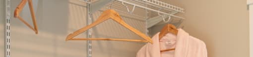 a rack with a robe and shoes on it in a closet at The Yards at Malvern, Malvern, PA