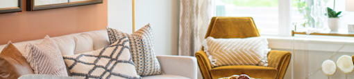 a living room with a couch and a chair and a window at The Yards at Malvern, Malvern, PA