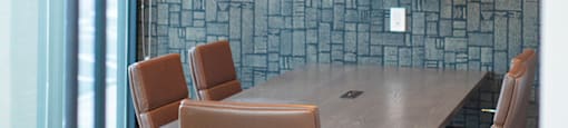 a conference room with a table and chairs and a television at The Yards at Malvern, Malvern, PA