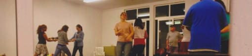 a group of people standing in a room
