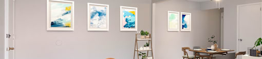a living room with grey walls and a dining room in the background at Bedford Castle, Bedford Heights, OH