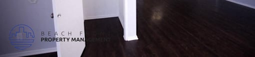 the living room and dining room of an empty house